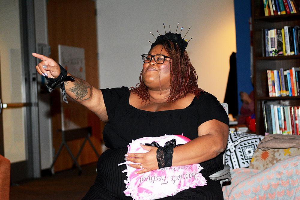 Angela Gay, new director of the AACC, offers some pointers on posing during the Afro-Futurism photo shoot on Sunday, Nov. 18, 2019 when she was the assistant director of the Women's Center.&#160;