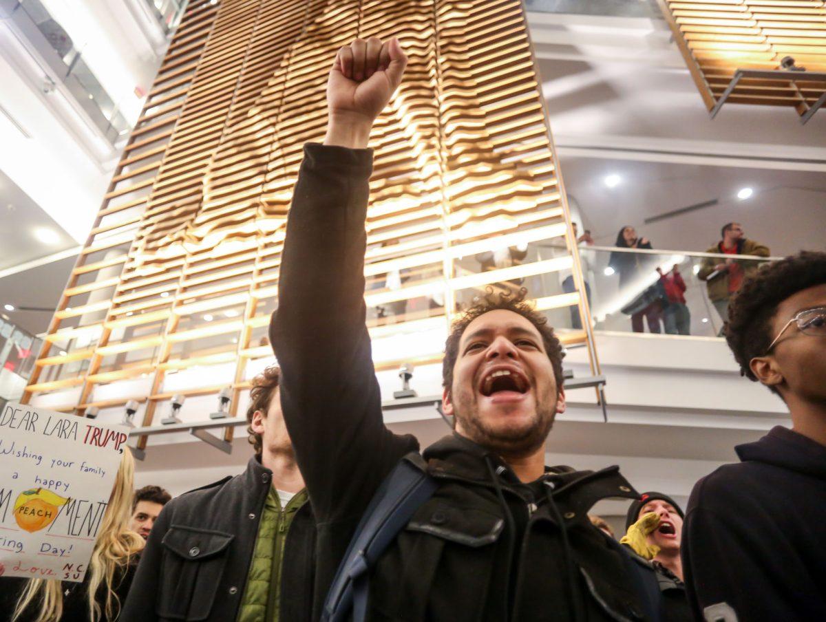 Osvaldo Rodriguez, a junior studying Human Biology, chants during the No Hate At NC State protest of a Turning Point event in Talley Student Center on Wednesday, Nov. 13, 2019. "I'm out here to show solidarity and support for a lot of my friends," he said. "And I can't believe that NC State would allow Charlie Kirk on our campus."