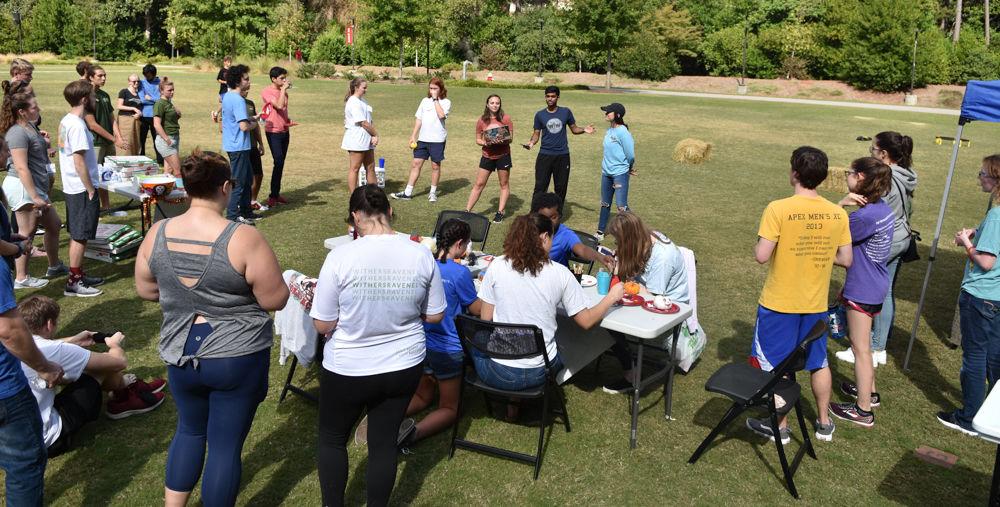Participants gather for the award distribution after the Water Walk at Stafford Commons on Oct. 26, 2019. The Water Walk is an event where racers experience what it is like from a global perspective for the average women to transport clean water by walking two laps around the commons with a full bucket of water. Proceeds for this event go to support Wine to Water, an organization whose efforts go to bringing clean water to those in need.