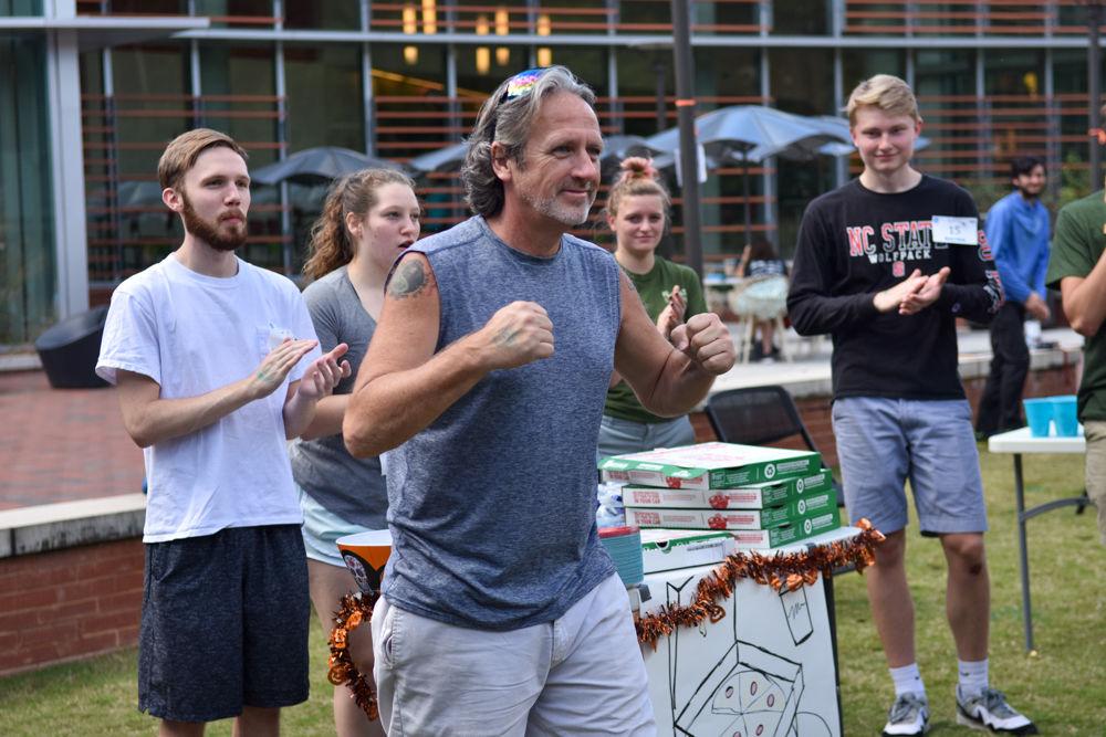 Mark Vaughn celebrates a winning time at this years Water Walk at Stafford Commons on Oct. 26, 2019. The Water Walk is an event where racers experience what it is like from a global perspective for the average women to transport clean water by walking two laps around the commons with a full bucket of water. Proceeds for this event go to support Wine to Water, an organization whose efforts go to bringing clean water to those in need.