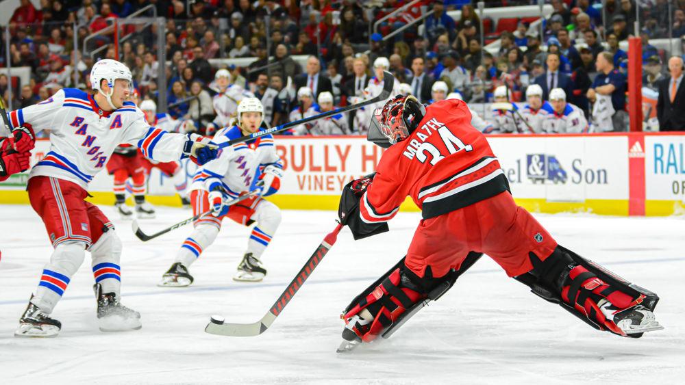 Hurricanes goaltender Petr Mrazek clears the puck against the New York Rangers on Thursday, Nov. 7 at PNC Arena. Mrazek saved 15 of the 18 shots he faced as the Hurricanes lost 4-2.