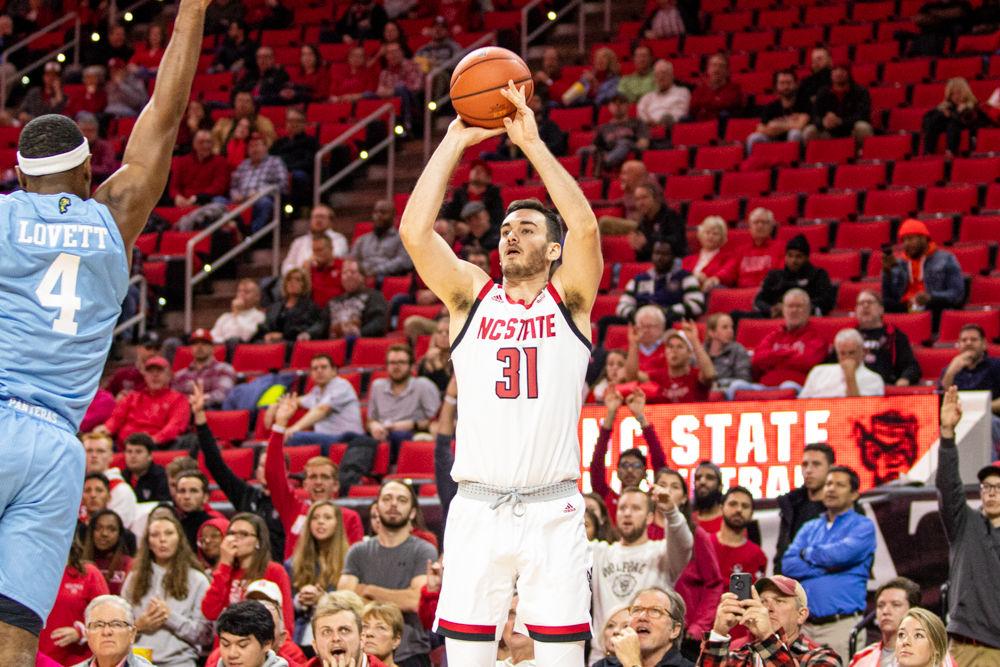 Graduate forward Pat Andree attempts a three point shot on Wednesday, Nov. 13, 2019 at PNC Arena. Andree tallied 14 points on 4-4 shooting. The Wolfpack won 86-77.