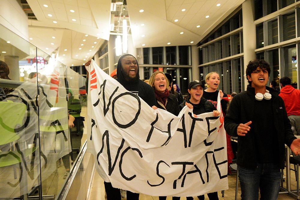 Christian Wade and Mikhail Reza lead the procession during the No Hate at NC State Protest on Wednesday, Nov. 13, 2019. The No Hate at NC State protest was protesting the Turning Point U.S.A. Culture War event.