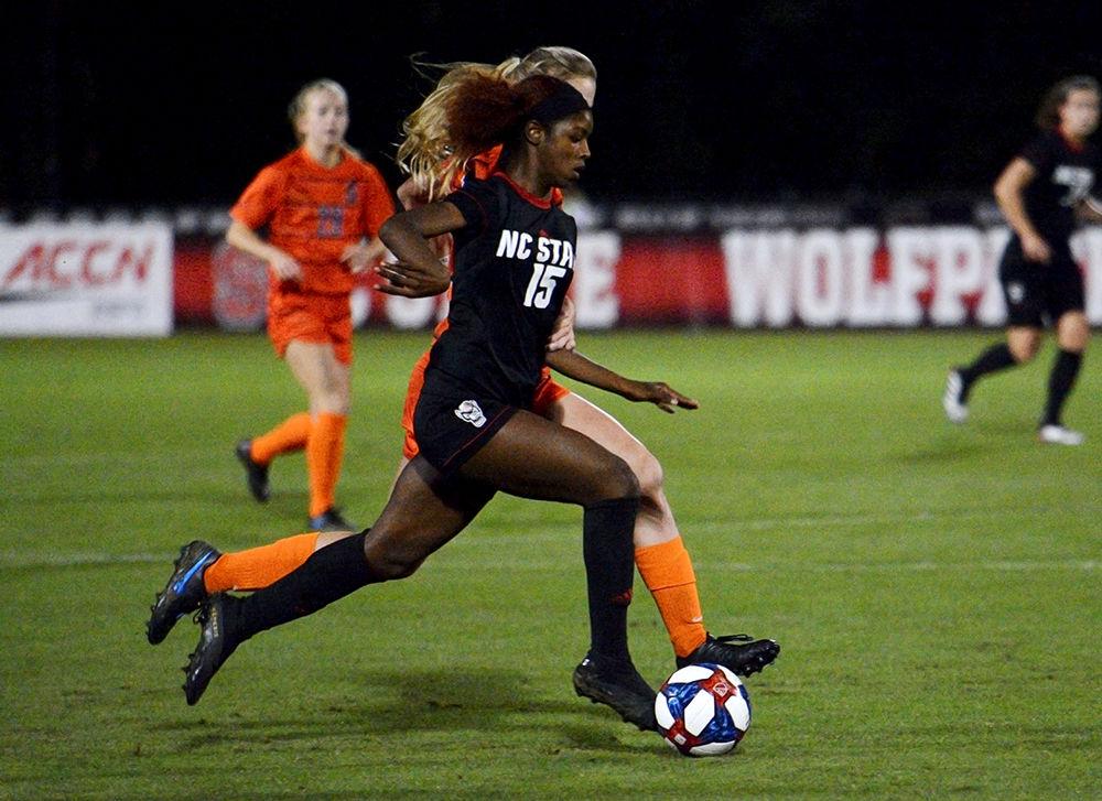 Freshman forward, Jameese Joseph dribbles the ball past a defender at Dail Soccer Stadium on Thursday October 24. Joseph had three shots in the Wolfpack&#8217;s 3-2 overtime win against Syracuse.