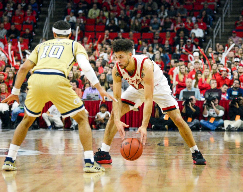 Redshirt junior guard, Devon Daniels dribbles the ball at the top of the key in PNC Arena on November 5, 2019. Daniels played in 34 minutes and scored 12 points, had three steals, five assists and three rebounds in the Wolfpacks 82-81 overtime loss to Georgia Tech.