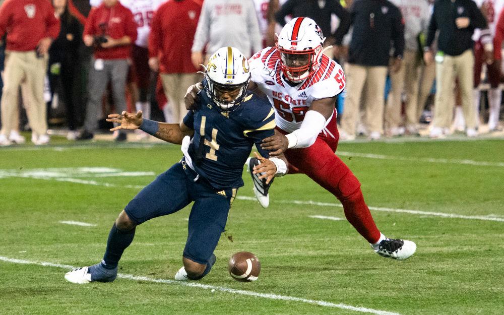 NC State redshirt sophomore defensive end Ibrahim Kante forces a fumble during NC State's game against Georgia Tech at Bobby Dodd Stadium on Nov. 22, 2019. The Wolfpack lost, 28-26.