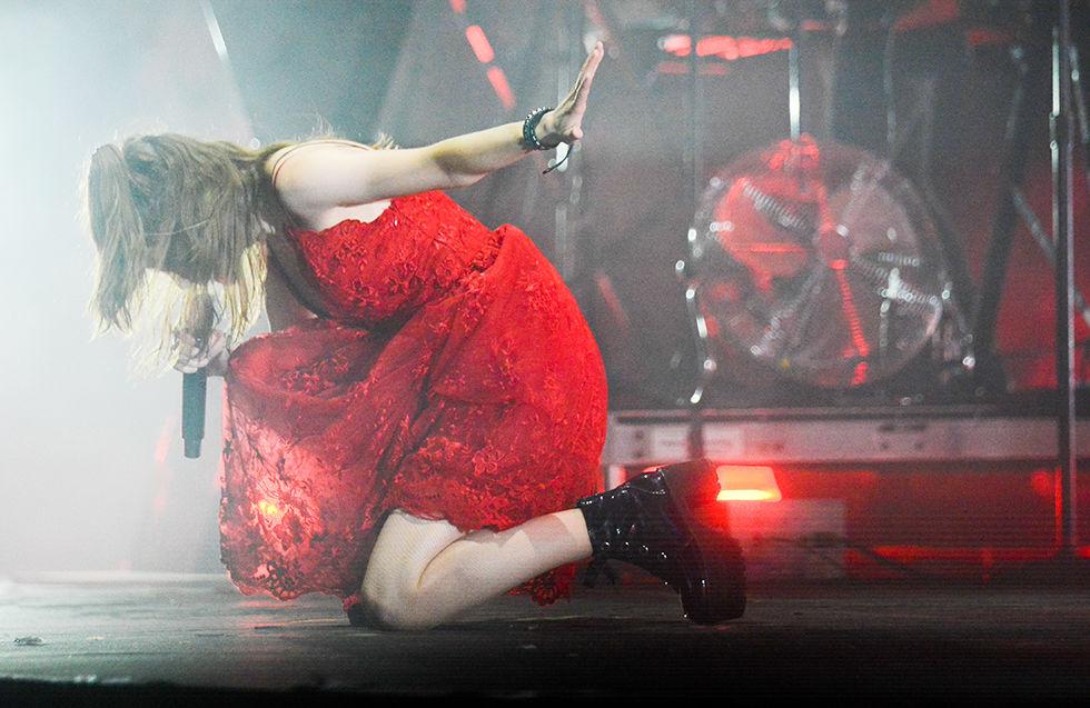 Lauren Mayberry, lead singer of Chvrches, kneels on the stage as she becomes engrossed in the song at Hopscotch Music Festival on Saturday, Sept. 7, 2019.. This is the 10th annual Hopscotch festival, an event which bring dozens of artists into the spotlight.
