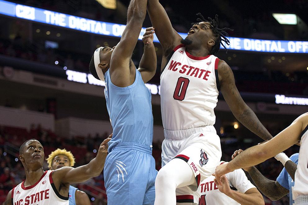 Redshirt junior forward DJ Funderburk leaps to push the basketball into the hoop during the game against Florida International University in PNC Arena, Wednesday, Nov. 13, 2019. Funderburk had two blocks, two steals, and seven rebounds to help lead the Wolfpack to a 86-77 victory over the FIU Panthers in regulation time. The Pack is now 1-1 for the season.