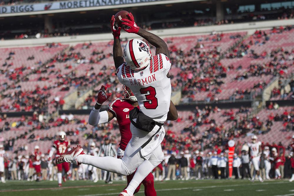 Junior wide receiver Kelvin Harmon catches a pass during the 52-10 win against Louisville at Cardinal Stadium on Saturday, Nov. 17. Harmon had 100 receiving yards on the day, marking his second year in a row gaining at least 1,000 receiving yards.&#160;