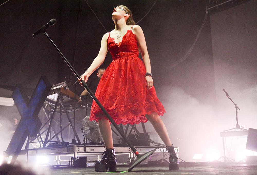 Lauren Mayberry, lead singer of Chvrches, leans the mic in time with the music. at Hopscotch Music Festival on Saturday, Sept. 7, 2019. This is the 10th annual Hopscotch festival, an event which bring dozens of artists into the spotlight.