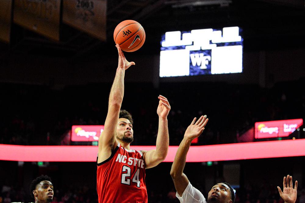 Redshirt junior guard Devon Daniels attacks the basket against Wake Forest on on Saturday, Dec. 7 at Lawrence Joel Veterans Memorial Coliseum. Daniels recorded 12 points and seven rebounds as the Wolfpack won 91-82.