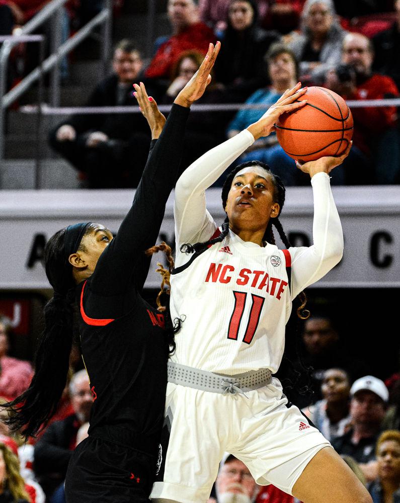 Freshman wing Jakia Brown-Turner shoots against Maryland on Thursday, Dec. 5, 2019 at Reynolds Coliseum. Brown-Turner recorded seven points and five rebounds as the Wolfpack won 66-59.