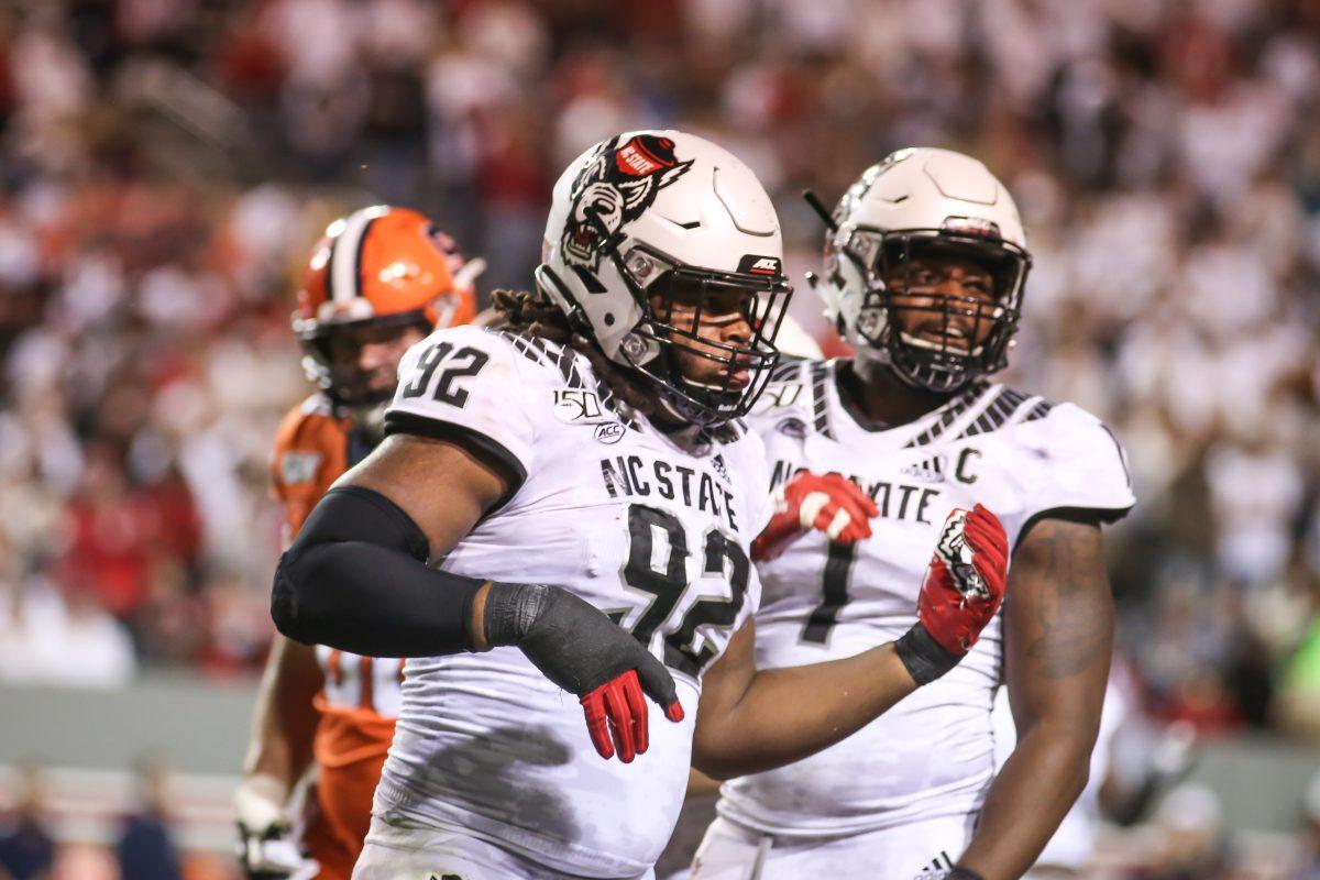 NC State graduate student Larrell Murchison celebrates a tackle for loss by playing air guitar. NC State hosted the Syracuse Orange on Thursday, October 10, 2019. NC State won the game 16-10. Murchison had 6 tackles and 2 sacks.