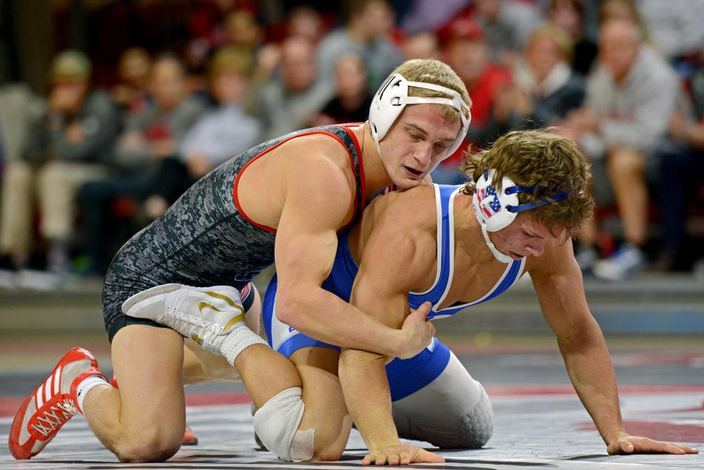Redshirt sophomore Hayden Hidlay, No. 4 in the 157 weight class, grabs hold of Duke sophomore Benjamin Anderson on Friday, Jan. 25 in Reynolds Coliseum. Hidlay beat Anderson 15-5 during the No. 8 Wolfpack's 30-12 victory over Duke.