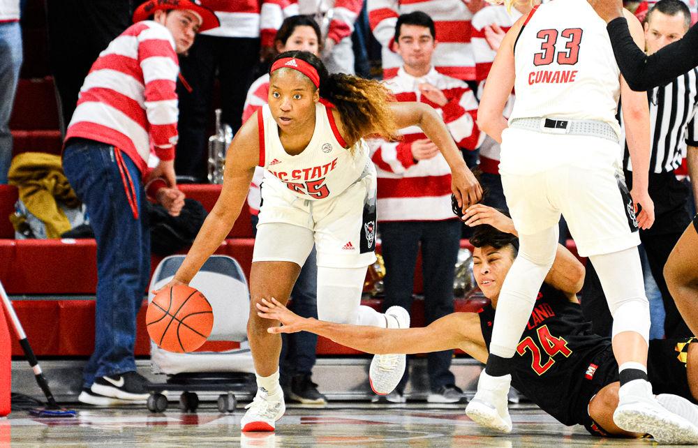 Junior forward Kayla Jones dribbles up court against Maryland on Thursday, Dec. 5, 2019 at Reynolds Coliseum. Jones recorded 11 points and 14 rebounds as the Wolfpack won 66-59.