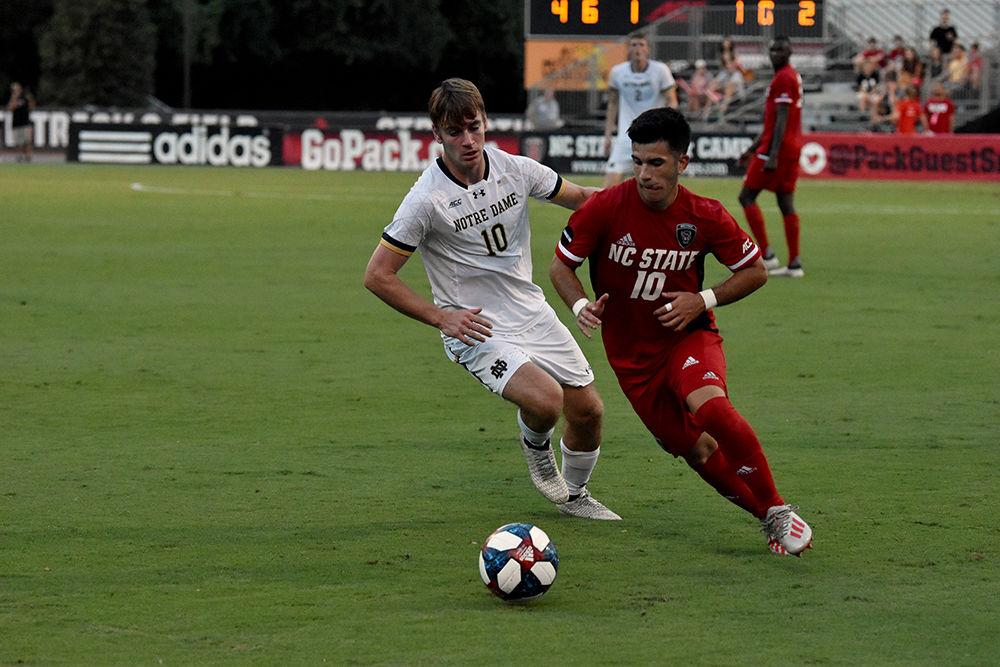 Junior midfielder David Loera cuts past a Notre Dame player on Friday, Oct. 4, 2019 at Dail Soccer Stadium. NC State beat Notre Dame 2-0.