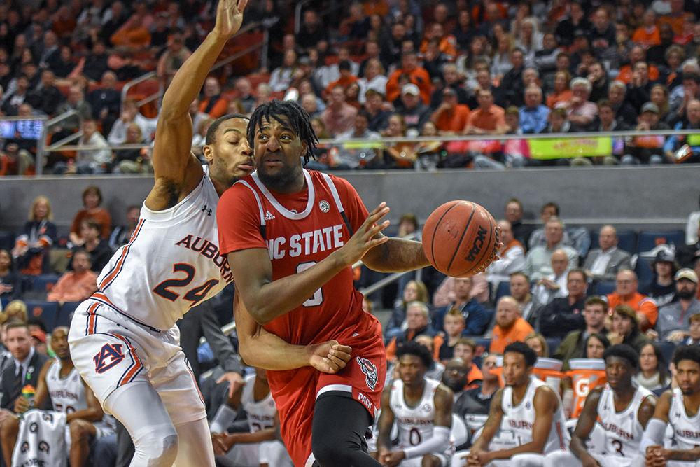 Redshirt junior forward DJ Funderburk keeps the ball away from an Auburn defender in an attempt to get to the basket on Thursday, Dec. 19, 2019 at Auburn Arena in Alabama. Funderburk shot 5-8 from the field and totaled 12 points in the 79-73 loss to the Tigers.