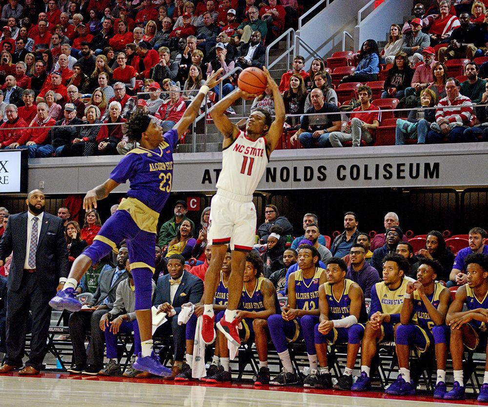 Senior guard Markell Johnson shoots a three pointer against Alcorn State at Reynolds Coliseum on Tuesday, Nov. 19, 2019. NC State beat Alcorn State 87-64.