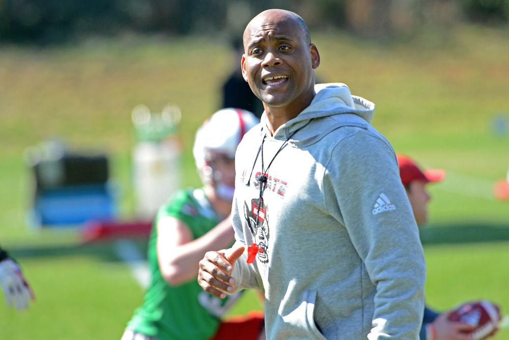 Co-offensive coordinator/running backs coach Des Kitchings yells at spring practice on Saturday, March 2, 2019 at NC State Football&#8217;s outdoor practice fields.