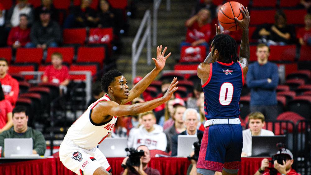 Senior guard Markell Johnson defends Detroit Mercy guard Antoine Davis on Sunday, Nov. 10, 2019 at PNC Arena. Johnson recorded 10 assists and seven rebounds as the Wolfpack won 84-65.