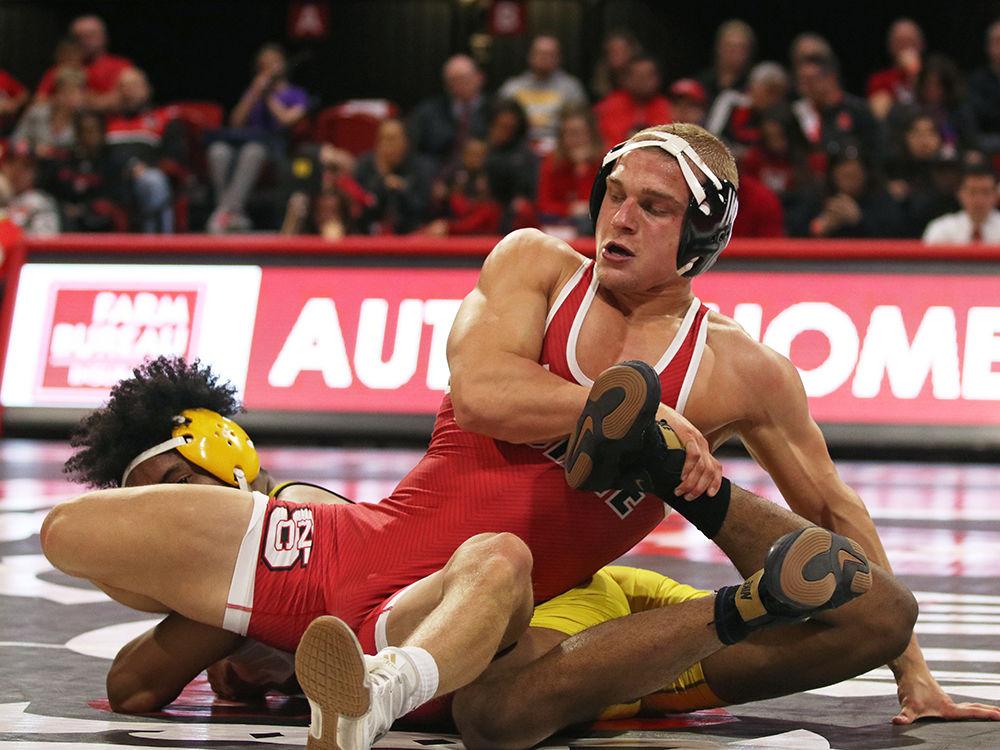 Redshirt sophomore Hayden Hidlay holds down Appalachian State&#8217;s Angel Najar at Reynolds Coliseum on Tuesday, Dec. 4. Hidlay won the final match before the break with a score of 10-2. The Wolfpack won against Appalachian State 29-9.