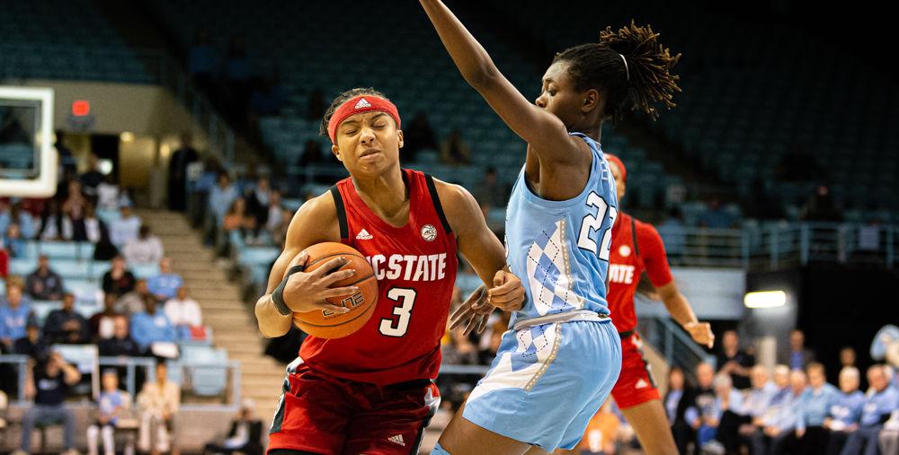 Junior guard Kai Crutchfield commits an offensive foul by pushing off UNC-Chapel Hill guard Shayla Bennett on Thursday, Jan. 9 at Carmichael Arena. Crutchfield scored three points while Bennett totaled 20, leading the Tar Heels to a 66-60 win and giving the Wolfpack their first loss of the season.