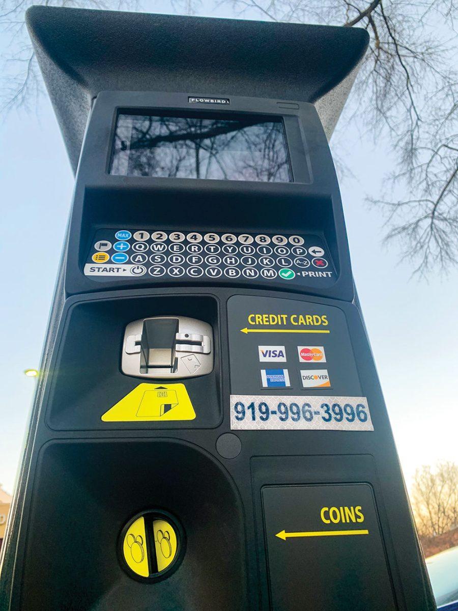 Parking meters line Hillsborough Street. Students and locals must pay to park at designated spots before 8 p.m.
