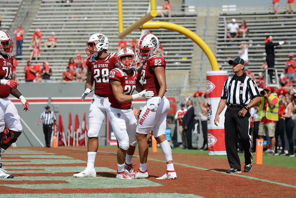 Freshman running back Jordan Houston celebrates with teammates after scoring a touchdown at Carter-Finley Stadium on Saturday, Sept. 7, 2019. Houston rushed 73 yards and scored one touchdown for NC State. The Wolfpack defeated WCU, 41-0.