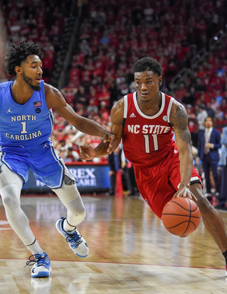 Senior guard Markell Johnson drives down the court during the game versus UNC on Monday, Jan. 27, 2020 in PNC Arena. Johnson scored 12 points and had 6 assists against the Tar Heels. NC State lost to UNC 75-65.