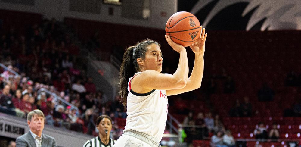 Senior guard Aislinn Konig shoots against Virginia on Sunday, Jan. 5, 2020 at Reynolds Coliseum. Konig reached the 1,000 career points mark during the first half, totaling nine points and five assists on the game. The Wolfpack won 80-60.