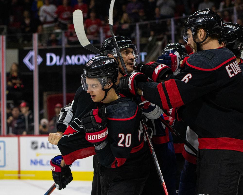 Hurricanes right wing Sebastian Aho is held back by the referee after a fight breaks out between the Hurricanes and the Capitals on Friday, Jan. 3, 2020 at PNC Arena. Aho had one assist in the 4-3 loss.