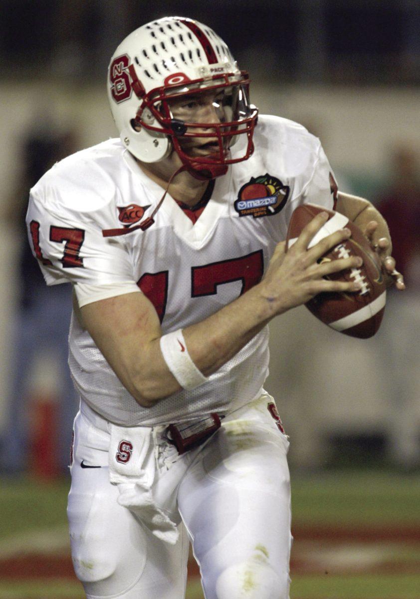 Philip Rivers scrambles and looks for a receiver to pass to during the Tangerine Bowl on Dec. 22, 2003.