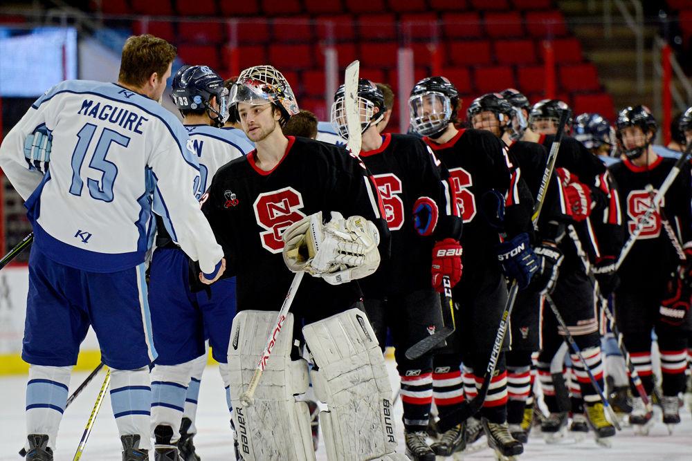 Senior goalie Joey Hall and the NC State Ice Hockey team shake hands after the game against UNC-Chapel Hill at PNC Arena on Wednesday, Jan. 23. Hall shutout the Tar Heels, helping the Icepack to win 5-0.