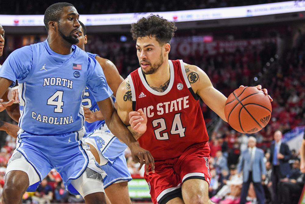 Redshirt junior guard Devon Daniels looks to make a break towards the basket during the game versus UNC on Monday, Jan. 27, 2020 in PNC Arena. Daniels scored 17 points and had 6 rebounds against the Tar Heels. NC State lost to UNC 75-65.