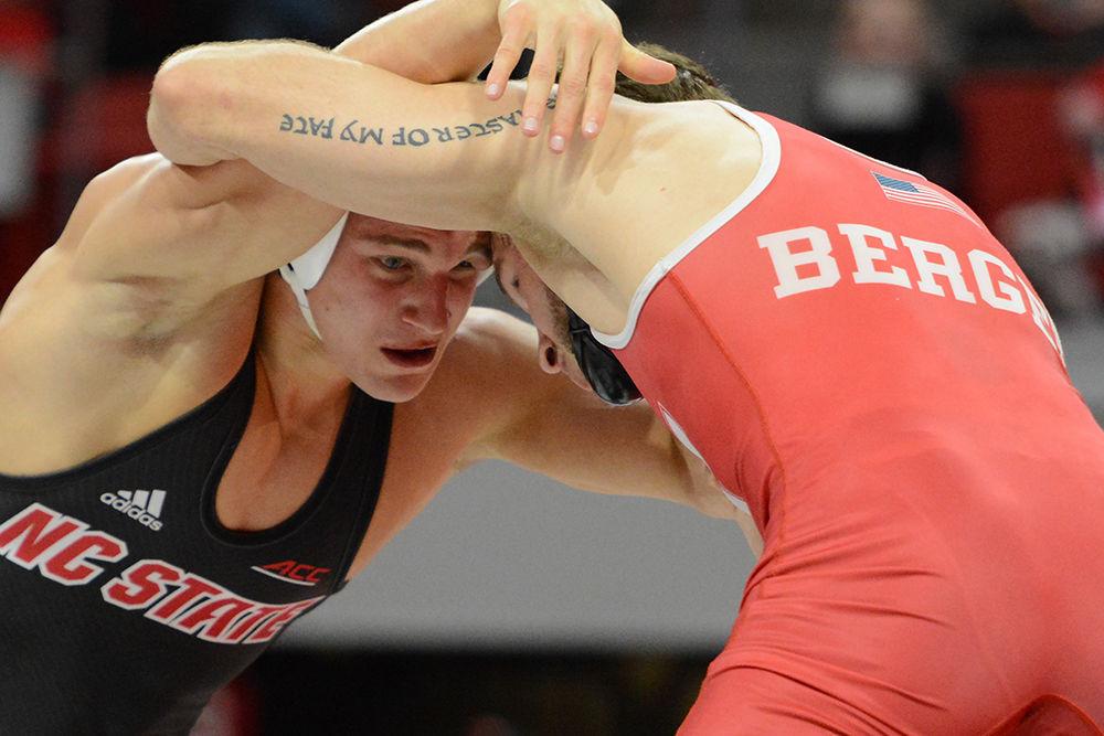 Redshirt sophomore Hayden Hidlay in the 157-pound weight class wrestles with Nebraska's Tyler Berger in Reynolds Coliseum on Dec. 16, 2018. The Wolfpack beat the Huskers 18-17, to continue their undefeated streak.