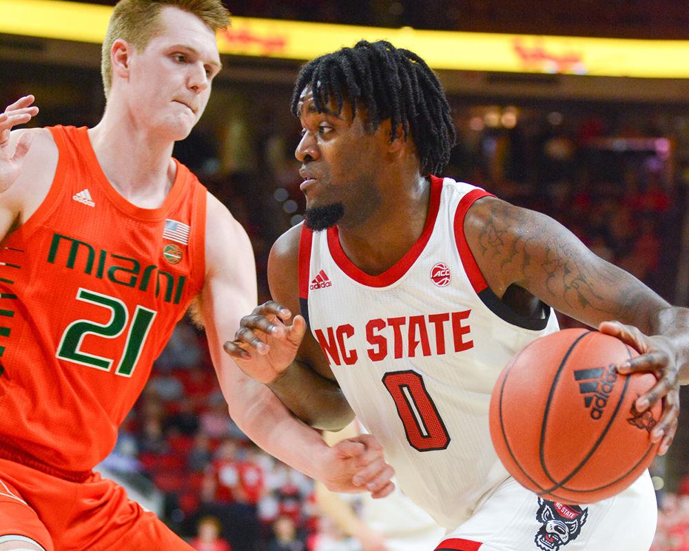 Redshirt junior forward DJ Funderburk drives to the basket during the game versus Miami on Wednesday, Jan. 15, 2020 in PNC Arena. Funderburk was the Wolfpack's top scorer with 19 points and 8 rebounds. The Wolfpack beat the Hurricanes 80-63.