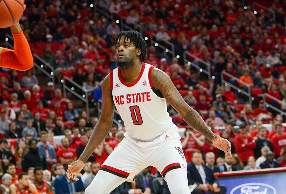 Redshirt junior foward DJ Funderburk blocks a Clemson player at the PNC Arena on Saturday, Jan. 18, 2020. The Wolfpack beat the Tigers 60-54.