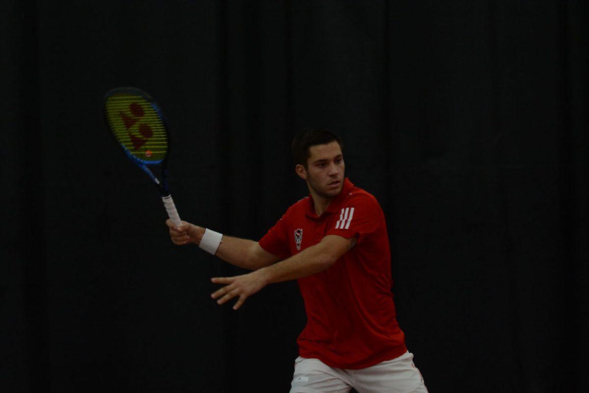 Alexis Galarneau, a senior, prepares to receive the ball in the match against USC Upstate on Saturday, Jan. 11, 2020. In the 18-19 season, he was ranked No. 26 in singles, the highest final singles ranking for a Wolfpack player in program history.