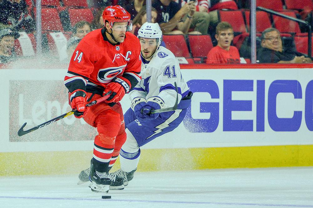 Carolina Hurricanes captain and forward Justin Williams looks to pass the puck during the game versus the Tampa Bay Lightning on Wednesday, Sept. 19, 2018 in PNC Arena. The Canes beat the Lightning 6-1.