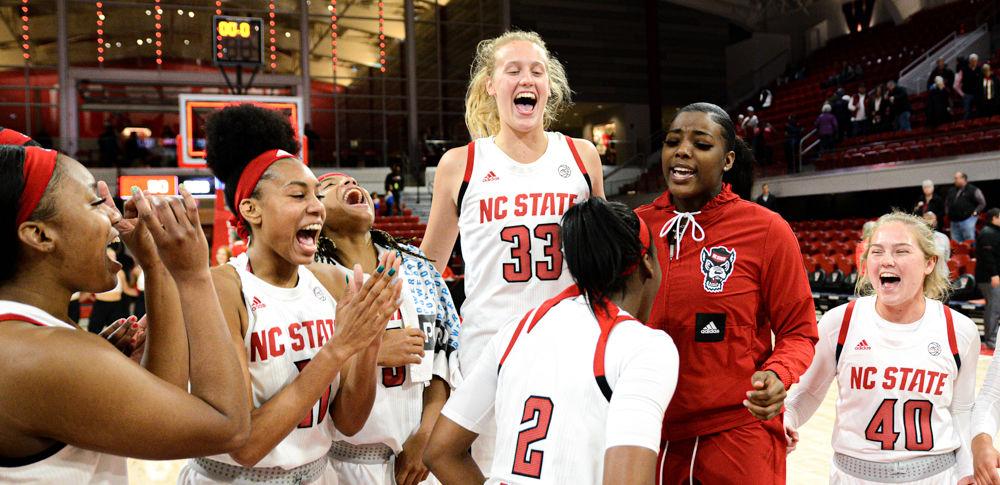 NC State women's basketball celebrates their win over Chattanooga on Thursday, Dec. 19, 2019 at Reynolds Coliseum. The Wolfpack won 74-38.