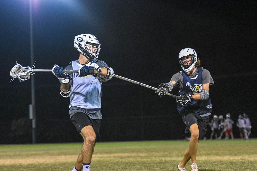 First years Sam Ellison and Will Beauchamp scrimmage during their Fall-ball practice at the Method Road Fields on Monday, Sept. 30, 2019. Coached by Chris Demarest, the PackLAX team plays in the Southeastern Lacrosse Conference (SELC) against teams like UNC, Clemson, and ECU.