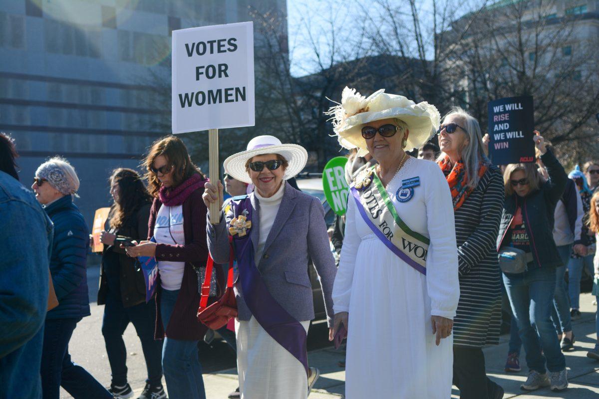 Women's rights advocates walk down the streets of Raleigh during the 4th annual Raleigh Women's March on Sunday, Jan. 26, 2020. The annual event is hosted by Women Mobilize NC, a group who supports and advocates for groups who are oppressed in hopes to overcome hate and discrimination.