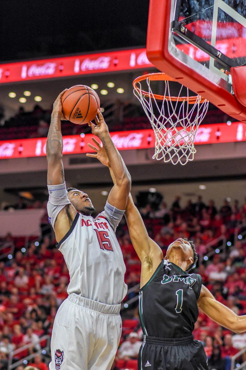 Redshirt freshman forward Manny Bates goes up to dunk the ball over the Mount Olive defense on Sunday, Oct. 27, 2019 in PNC Arena. NC State beat Mount Olive 113-73. Bates scored 10 points, had 4 rebounds, and 2 blocks against the Trojans. NC State beat Mount Olive 113-73.