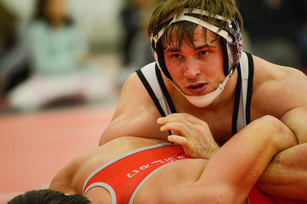 Tyrie Houghton, a sophomore, wrestles in the 197 weight class during the match against Belmont Abbey on Saturday, Nov. 16, 2019. He went 11-10 during the 2018-19 season.