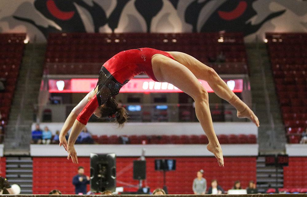 Lauren Kent, a junior studying business administration, performs her beam routine at Reynolds Coliseum on Feb. 1, 2020. Kent took first place along with her teammates Chloe Negrete and Alexis Beucler with a tied score of 9.850. The Wolfpack defeated the Tar Heels 196.250-193.375, setting a season record score.