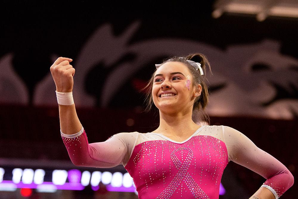 Freshman Emily Shepard smiles during her Floor performance on Saturday, Feb. 15 at Reynolds Coliseum. Shepard tied for fourteenth in the Floor Exercise with a score 9.775.
