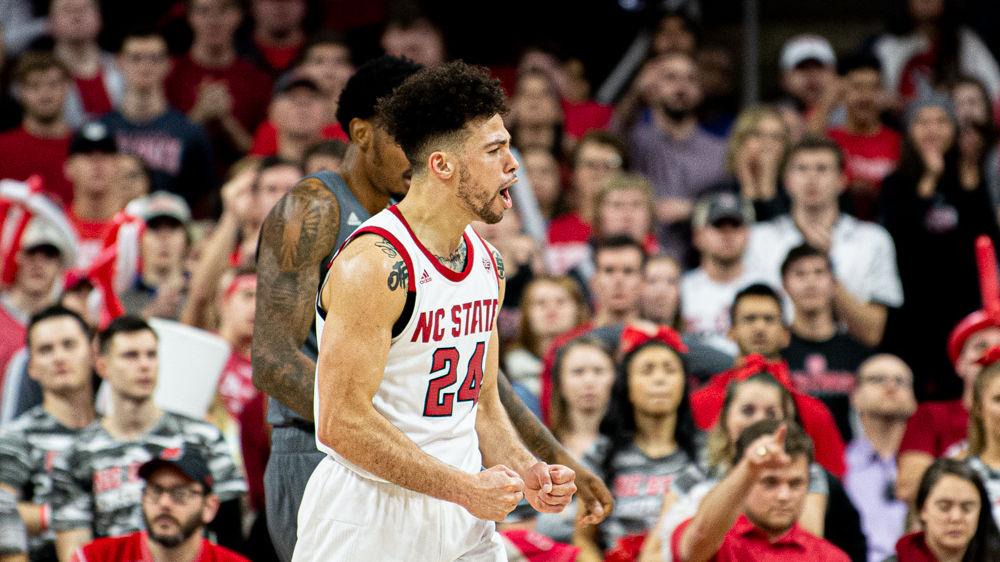 Redshirt junior guard Devon Daniels celebrates during the game against Louisville on Saturday, Feb. 1, 2020 at PNC Arena. Daniels recorded 12 points and five rebounds as the Wolfpack lost 77-57.