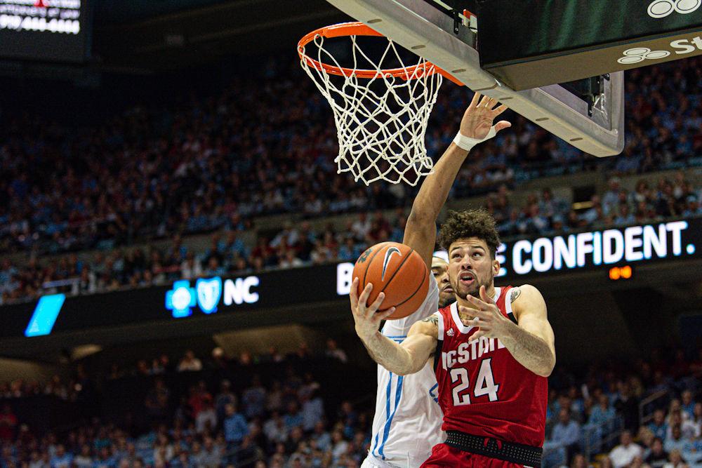 Redshirt junior guard Devon Daniels attacks the basket against North Carolina on Tuesday, Feb. 26, 2020 in the Dean E. Smith Center. Daniels scored 10 points as the Wolfpack lost 85-79.
