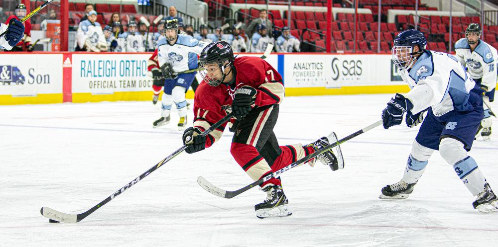 NC State Icepack forward Garrett Auriene attacks the UNC Ice Hockey defense on Monday, Jan. 20, 2020 at PNC Arena. The Icepack won 9-3.