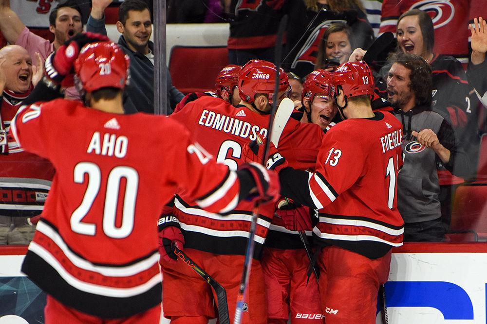 Carolina Hurricanes players celebrate Andrei Svechnikov's third period goal against the Vancouver Canucks on Sunday, Feb. 2, 2020 in PNC Arena. The Hurricanes beat the Canucks in a shootout to win the game 4-3.